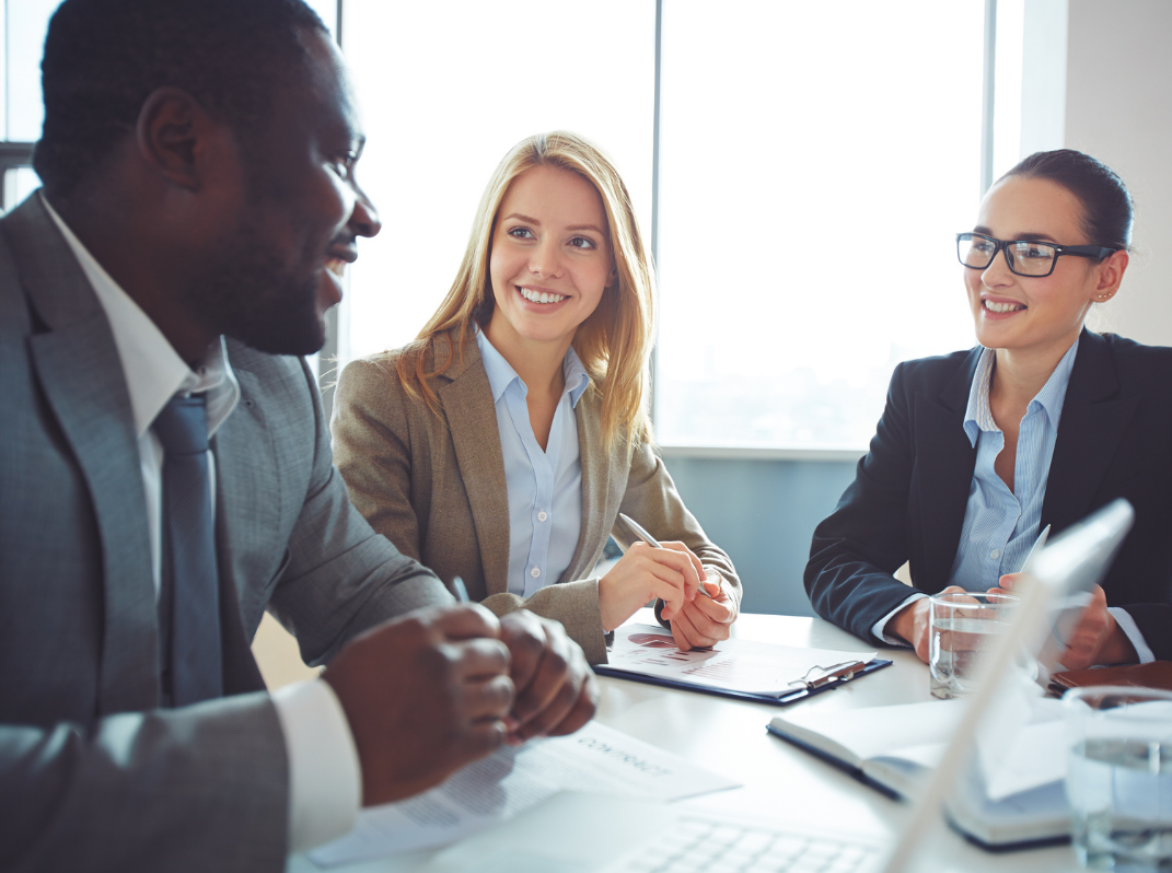 diverse group of business people discussing replacing InfoPath